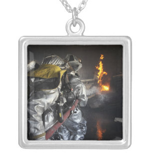 Firefighters extinguish a fire in a training ro silver plated necklace