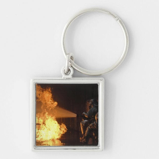 Firefighters extinguish a simulated battery fir key ring (Front)