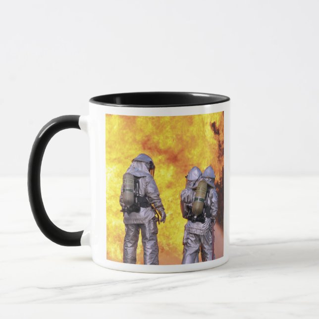 Firefighters extinguish an aircraft fire mug (Left)