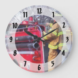 Fireman On Back Of Fire Truck Large Clock