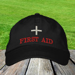 First Aid embroidered baseball cap Red / black<br><div class="desc">Embroidered Hats: Classic baseball cap with text "FIRST AID" for first aiders,  help staff,  event organizers,  medical staff</div>
