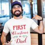 First Christmas as Dad family matching red text T-Shirt<br><div class="desc">This white t-shirt is perfect for personalized Christmas matching family outfits. 
It says "First Christmas as Dad" in a red modern font.
For further customization or other matching items,  please feel free to contact me.</div>