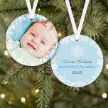 First Christmas Baby Boy Snowflake Frame Photo Ornament<br><div class="desc">Elegant snowflake framed baby's first Christmas photo ornament design features a round border wreath of white winter snowflakes that frame the baby boy's newborn photo. A custom "Baby's First Christmas" message appears on the back with text the can be personalised with baby boy's name and birth year. The baby blue...</div>