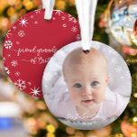 First Christmas Baby Photo Snowflakes Grandparents Ornament<br><div class="desc">“First Christmas.” A playful visual of white snowflakes and handwritten script typography with customised year, overlaying the photo of your choice, help you usher in Christmas and New Year. On the back, additional white snowflakes and handwritten typography with “proud grandparents of baby’s name” overlay a red background. Feel the warmth...</div>