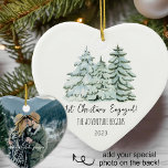 First Christmas Engaged Ceramic Ornament<br><div class="desc">This 1st Christmas engaged ornament is perfect for the newly engaged couple. The saying on it is The Adventure Begins which they will love. Add date and their names as well as a special photo for a wonderful engagement keepsake they will treasure. See coordinating items in our shop, Enchanted Finch....</div>