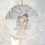 First Christmas Engaged Custom Photo Copper Script Ceramic Ornament<br><div class="desc">Commemorate your engagement with this beautiful modern keepsake ornament. The copper-coloured text reads "Our first Christmas engaged, " with the word "engaged" in elegant faux foil handwriting script with flourishes before and after. Replace the sample image with your favourite photo, and add your names and the year. A white gradient...</div>