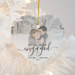 First Christmas Engaged Custom Photo Grey Script Ceramic Ornament<br><div class="desc">Commemorate your engagement with this beautiful heart-shaped keepsake ornament. The grey text reads "Our first Christmas engaged, " with the word "engaged" in elegant handwriting script with flourishes before and after. Replace the sample image with your favourite photo, and add your names and the year. A white gradient filter helps...</div>