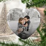 First Christmas Engaged Custom Photo White Script Ceramic Ornament<br><div class="desc">Commemorate your engagement with this beautiful heart-shaped keepsake ornament. The white text reads "Our first Christmas engaged, " with the word "engaged" in elegant handwriting script with flourishes before and after. Replace the sample image with your favourite photo, and add your names and the year. A black gradient filter helps...</div>