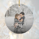 First Christmas Engaged Custom Photo White Script Ceramic Ornament<br><div class="desc">Commemorate your engagement with this beautiful modern keepsake ornament. The white text reads "Our first Christmas engaged, " with the word "engaged" in elegant handwriting script with flourishes before and after. Replace the sample image with your favourite photo, and add your names and the year. A dark gradient filter helps...</div>