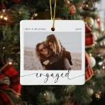 First Christmas Engaged Keepsake  Ceramic Ornament<br><div class="desc">Introducing the perfect Christmas ornament for the soon to be Mr and Mrs! This customisable ornament is the perfect way to celebrate your first Christmas together as an engaged couple. With a minimalist modern design and handwritten calligraphy, this ornament will look stunning on your tree. The best part? You get...</div>