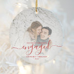 First Christmas Engaged Photo Bright Red Script Ceramic Ornament<br><div class="desc">Commemorate your engagement with this beautiful modern keepsake ornament. The red text reads "Our first Christmas engaged, " with the word "engaged" in elegant handwriting script with flourishes before and after. Replace the sample image with your favorite photo, and add your names and the year. A white gradient filter helps...</div>