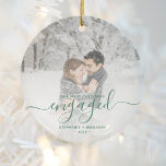 First Christmas Engaged Photo Pine Green Script Ceramic Ornament<br><div class="desc">Commemorate your engagement with this beautiful modern keepsake ornament. The pine green text reads "Our first Christmas engaged, " with the word "engaged" in elegant handwriting script with flourishes before and after. Replace the sample image with your favourite photo, and add your names and the year. A white gradient filter...</div>