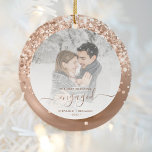 First Christmas Engaged Photo Rose Gold Glitter Ceramic Ornament<br><div class="desc">Commemorate your engagement with this beautiful modern keepsake photo ornament. The rose gold-colored text reads "Our first Christmas engaged, " with the word "engaged" in elegant rose gold faux foil script with flourishes before and after. The border features a bronze faux foil design sprinkled with sparkling rose gold faux glitter....</div>