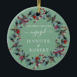First Christmas Engaged Sage Green Wreath Ceramic Ornament<br><div class="desc">Romantic ornament for engaged or married couple features beautiful Christmas wreath. You can change the background colour if you like.</div>