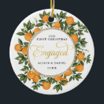 First Christmas Engaged Wedding Citrus Greenery Ceramic Ornament<br><div class="desc">This citrus inspired Christmas ornament features beautiful hand-painted oranges and lush greenery. Great for a summer wedding!. The text fields are fully editable except for the word "Engaged". Simply remove this word by clicking the delete button and add your own text if you require a different word.</div>