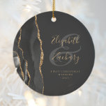 First Christmas Married Black Agate Gold Script Ceramic Ornament<br><div class="desc">This elegant modern ornament features a black watercolor agate design trimmed with faux gold glitter. Easily customise the gold-coloured text on an off-black background, with the names of the bride and groom in whimsical handwriting calligraphy over a large grey ampersand. The words "First Christmas Married" appear in serif font along...</div>