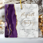 First Christmas Married Purple Agate Marble Gold Ceramic Ornament<br><div class="desc">This elegant modern ornament features a purple watercolor agate design trimmed with faux gold glitter. Easily customise the text on a grey and white marble background, with the names of the bride and groom in whimsical gold-coloured handwriting calligraphy over a large grey ampersand. The words "First Christmas Married" appear in...</div>