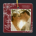 First Christmas Married Red Snowflakes Photo Ceramic Ornament<br><div class="desc">This square Christmas ornament is a perfect gift for the newly married couple. The design features a photo frame with handwritten text "Married" and is accented with light grey snowflakes on a dark red background. Personalise with a pictures of the couple,  their names and year.</div>
