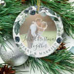 First Christmas merry and married couple photo  Ceramic Ornament<br><div class="desc">Watercolor green foliage eucalyptus greenery leaves wreath and a classy trendy handwritten style calligraphy script making a beautiful modern wedding newlyweds couple photo personalised keepsake Christmas tree ornament template.               Easy to replace the photo with your own! You can change the script text with yours.</div>