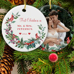 First Christmas Mr and Mrs floral elegant photo Ceramic Ornament<br><div class="desc">Winter classic traditional watercolor elegant Christmas wreath custom photo ornament template featuring coral red, burgundy, and green botanical foliage with seasonal pine cones, fir branches, holly berries, cardinal birds, and greenery leaves, and a modern trendy typography script over a clear white background. - Personalise it on both sides with your...</div>