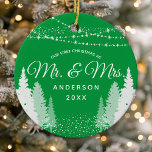 First Christmas Mr Mrs Green Winter String Lights Ceramic Ornament<br><div class="desc">Celebrate the newlyweds' first Christmas with this charming ceramic ornament. The design features a green winter string lights backdrop with the words "Mr. & Mrs." in a classic script. This personalised keepsake makes a thoughtful wedding or housewarming gift. The high-quality ornament comes ready to hang and is sure to be...</div>