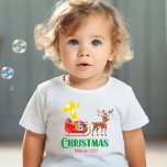 First Christmas Santa Sleigh Reindeer Name Year Baby T-Shirt<br><div class="desc">Let your little one spread the holiday magic with our adorable "My First Christmas" custom baby t-shirt! Personalise this merry design with your little one's name and the cherished year. This delightful shirt showcases a cheerful sleigh pulled by a festive reindeer, carrying a joyful '1' amidst a load of beautifully...</div>