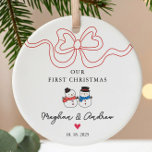 First Christmas Snowman Christmas Ceramic Ornament<br><div class="desc">Celebrate your love this holiday season with our personalised Christmas ornament featuring an adorable snowman couple adorned with a trendy ribbon bow. This charming keepsake is perfect for commemorating your first Christmas together, adding a touch of warmth and joy to your festive decor. Crafted with care, it can be customised...</div>
