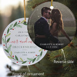 First Christmas Wreath Botanical Wedding Photo Ceramic Ornament<br><div class="desc">Capture the magic of your first Christmas as a married couple with this personalised ornament. The front showcases a beautiful botanical Christmas wreath, while the reverse features a heartwarming wedding photo that you can easily replace with your own special image. Customise the ornament with your last name, first names, and...</div>