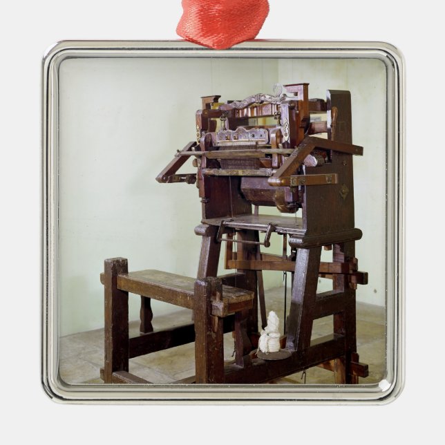 First loom for weaving stockings, 1750 metal ornament (Front)