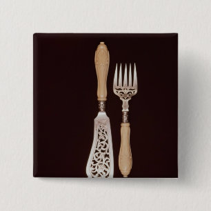 Fish-servers with carved ivory handles 15 cm square badge