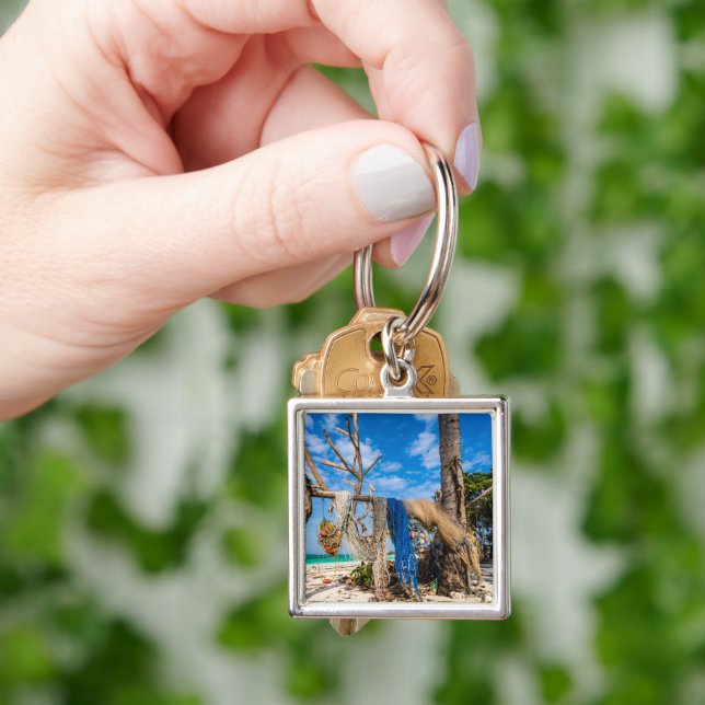 Fishing nets drying on the beach key ring (Hand)