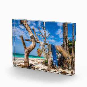 Fishing nets drying on the beach photo block