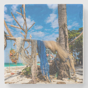 Fishing nets drying on the beach stone coaster