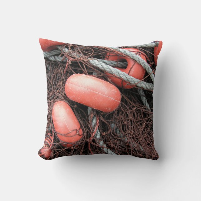 Fishing nets, floats and rope on the harbour cushion (Front)