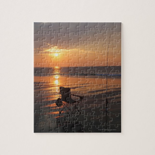 Fishing rod and chair by the ocean in the early jigsaw puzzle (Vertical)