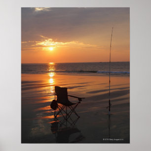 Fishing rod and chair by the ocean in the early poster