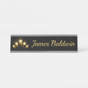 Five gold stars on black desk name plate