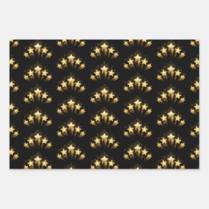 Five gold stars on black wrapping paper sheet