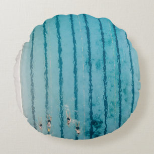 Five people swimming on pool round cushion