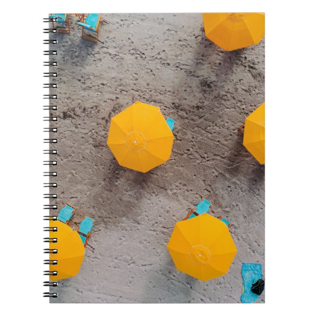 Five yellow umbrellas on sand at daytime notebook (Front)