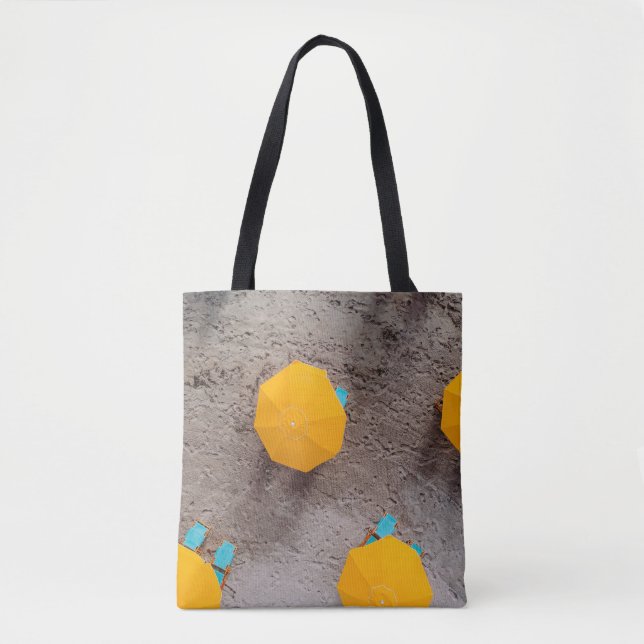 Five yellow umbrellas on sand at daytime tote bag (Front)