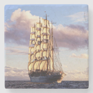 Flag ship setting sail at sea stone coaster