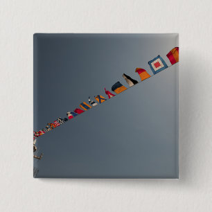 Flags fly over the deck of the USS Iwo Jima 15 Cm Square Badge