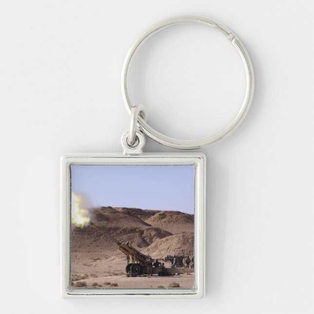 Flame and smoke emerge from the muzzle key ring (Front)