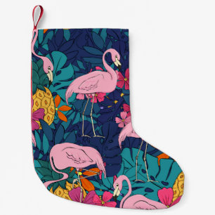 Flamingos on a background of tropical leaves and f small christmas stocking