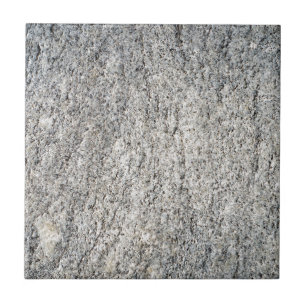 Flat surface of a grey granite stone tile