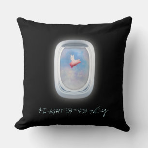 flight of fancy-pig flies past an aeroplane window cushion