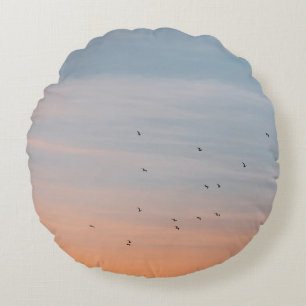 FLOCK OF BIRD AT THE BLUE AND ORANGE SKIES ROUND CUSHION