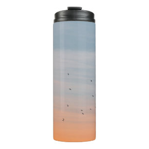 FLOCK OF BIRD AT THE BLUE AND ORANGE SKIES THERMAL TUMBLER