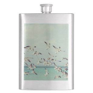 Flock of Flying Seagulls Over Ocean Hip Flask